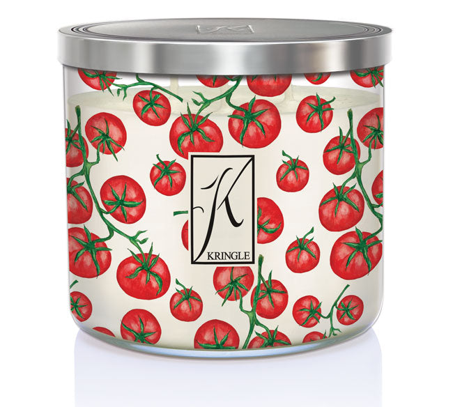 Cylindrical candle jar with tomato patterns, silver lid, and