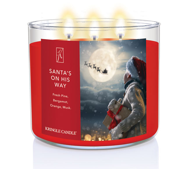Kringle Candle Christmas-themed candle with Santa Claus and a child on the label.