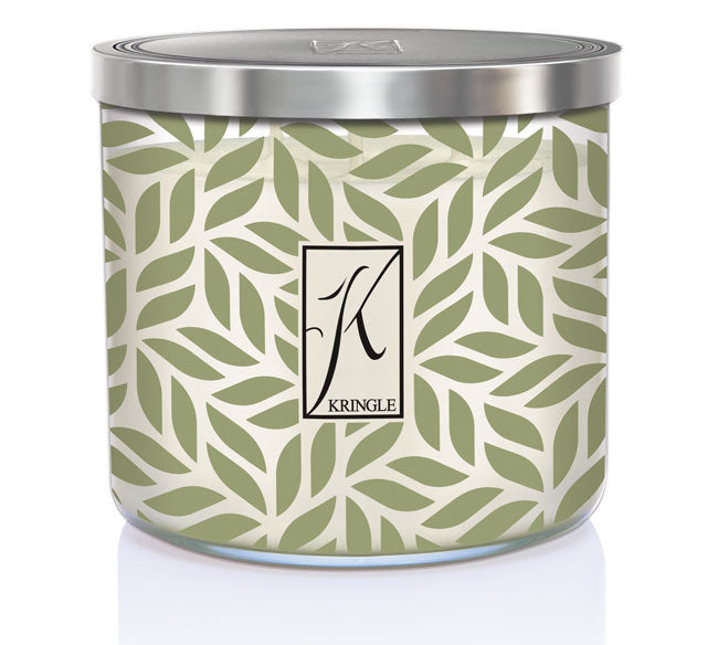 Decorative candle tin with a leaf pattern in green and cream, featuring a large