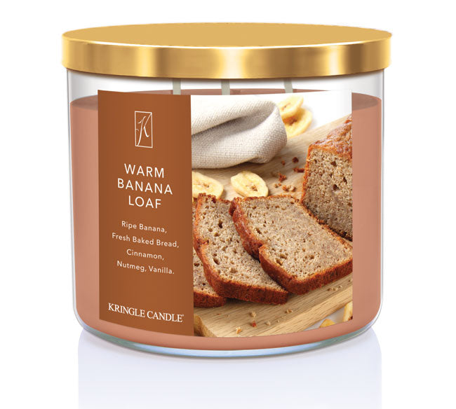 Kringle Candle Warm Banana Loaf candle with gold lid on a white background