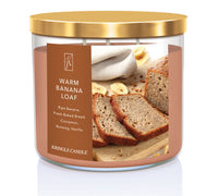 Kringle Candle Warm Banana Loaf candle with gold lid on a white background