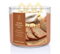 Kringle Candle Warm Banana Loaf candle with a label showing bread slices and banana slices.