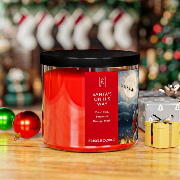 Kringle Candle Christmas-themed candle with festive background