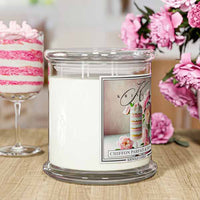Glass candle jar with label featuring layered dessert, pink peonies, and elegant script reading "Chiffon Parfait & Peony."