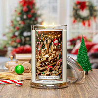 Decorative candle with Christmas-themed design on a wooden surface, surrounded by festive decorations.