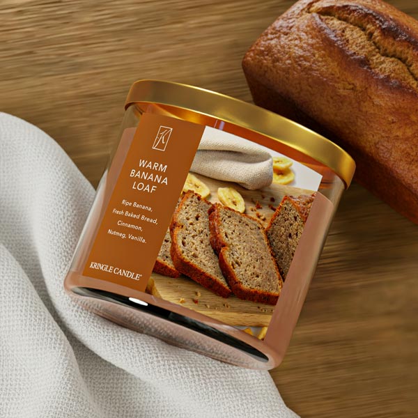 Kringle candle with 'Warm Banana Loaf' packaging on a wooden surface