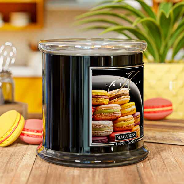 Kringle Candle Macarons 4-wick candle on a wooden surface with macaron cookies