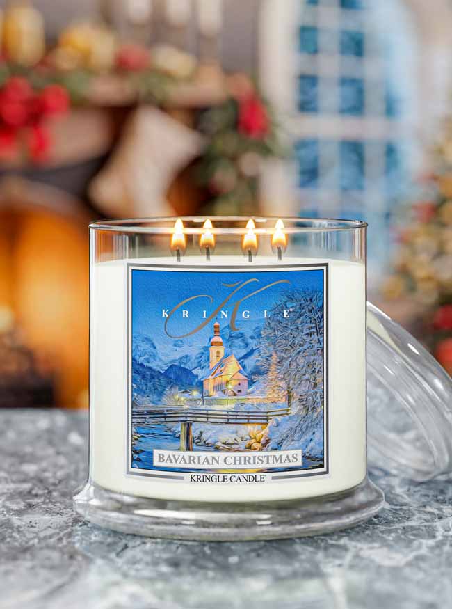 Kringle Candle Bavarian Christmas 4-wick candle with a festive wintertime with a church label on a marble surface, blurred holiday background in a home