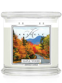 Kringle Candle Maple Woods scented 4-wick candle with a fall scene label on a white background