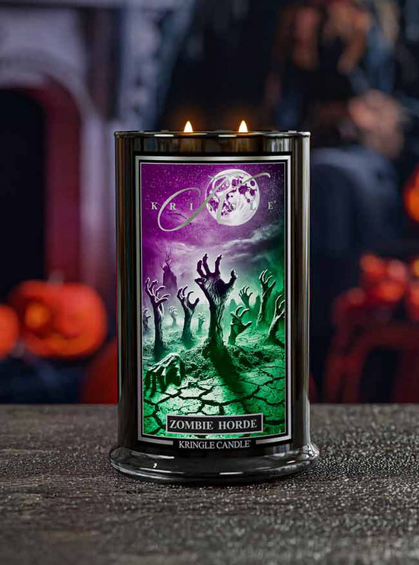 Kringle Candle Zombie Horde candle with a Halloween-themed label on a dark surface.