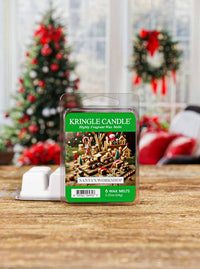 Kringle Candle wax melt package with Christmas-themed design on a wooden surface.