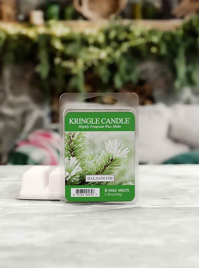 Kringle Candle Balsam Fir wax melt package on a surface with a blurred background