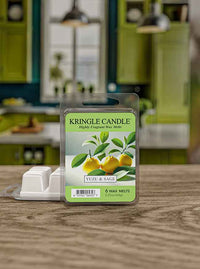 Pack of Kringle Candle Yuzu & Sage wax melts on a wooden table with a blurred kitchen background.