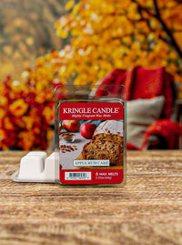 Wax melts in a transparent package. Label shows an apple rum cake with apples and spices in the background.