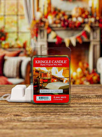 Packaging for "Whiskey & Embers" wax melts. The label shows a whiskey glass by a roaring fireplace.