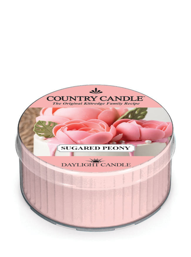 Round pink candle labeled