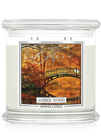 Kringle Candle 4-wick with 'Amber Wood' fragrance on a white background