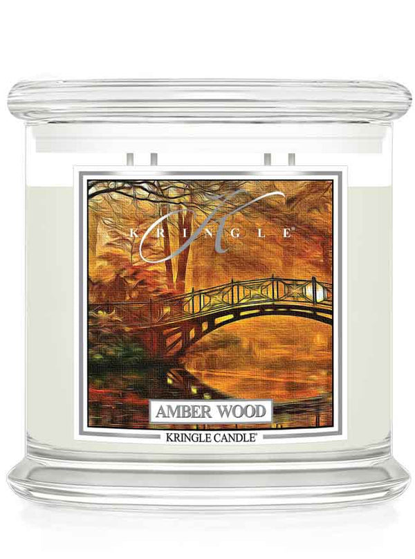 Kringle Candle 4-wick with 'Amber Wood' fragrance on a white background