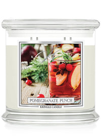 Kringle Candle Pomegranate Punch candle with a festive design on the label.