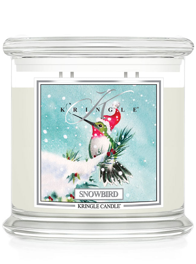 Kringle Candle Snowbird 4-wick scented candle with a festive label on a white background