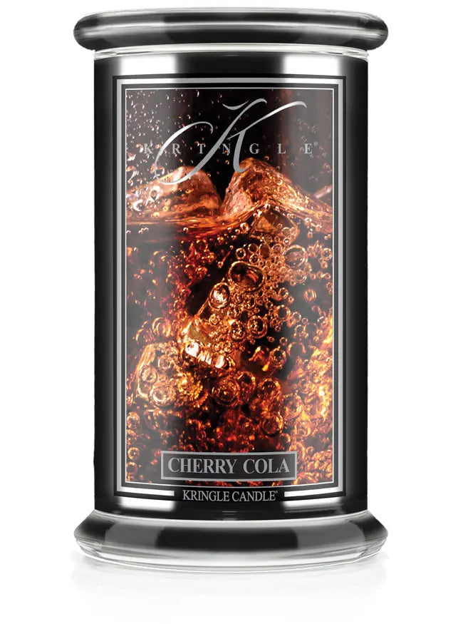 Studio product image of Kringle Candle’s Cherry Cola scented candle in a large jar with a black label and clear glass lid.