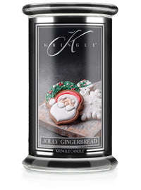 Kringle Candle with gingerbread cookie design on a white background