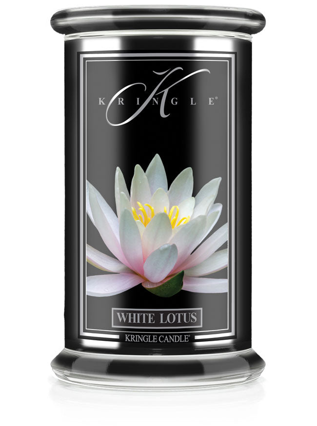 A candle jar labeled "White Lotus" with an image of a blooming white lotus flower on a black background.