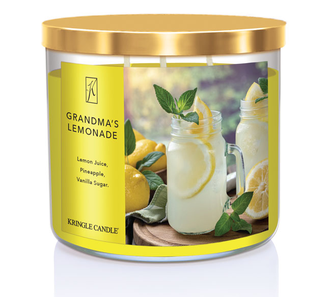 A three-wick candle in a clear glass jar with a gold lid and a refreshing drink-themed label. The label features two mason jars filled with lemonade, garnished with fresh lemon slices and mint leaves, surrounded by whole lemons. The candle’s wax is bright yellow, and the wicks are unlit. The scent notes listed are lemon juice, pineapple, and vanilla sugar.