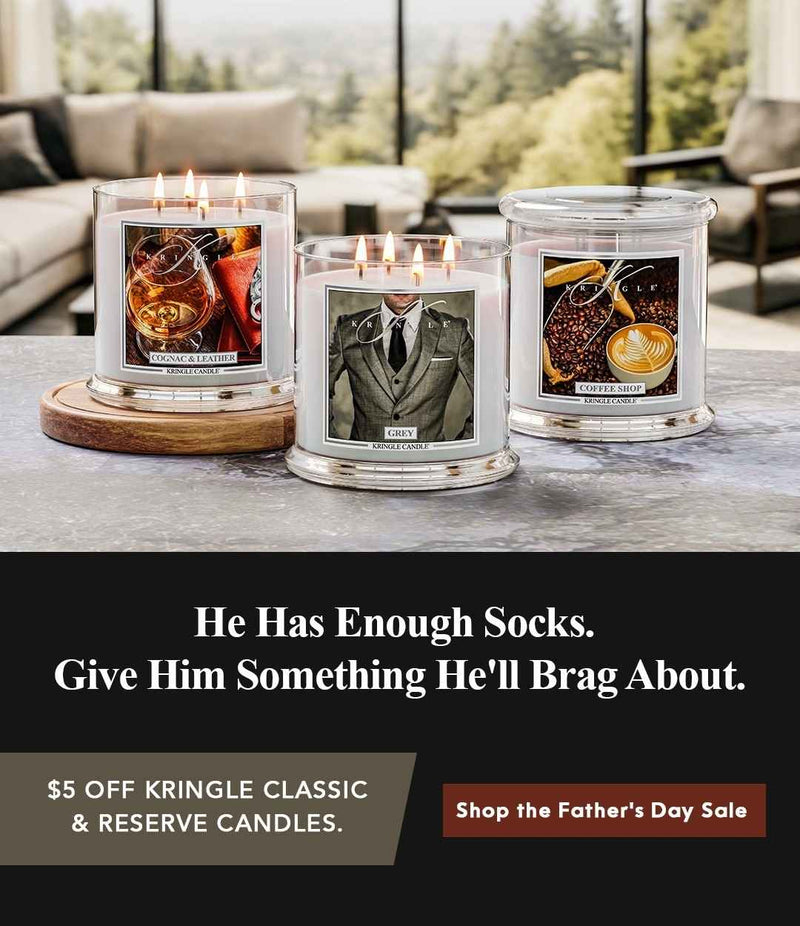 Three candles on a table with a promotional message for Father's Day sale.