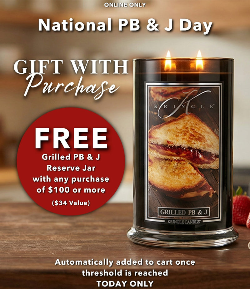 Krisingle Candle with grilled PB & J design on a wooden surface, promoting a free gift with purchase offer for National PB & J Day.