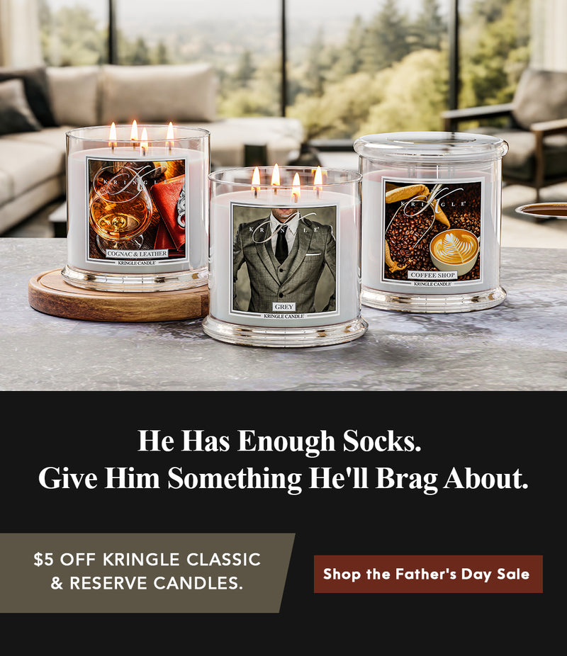 Three lit candles on a table with a promotional message for Father's Day sale.