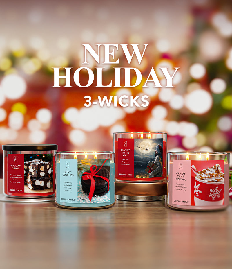 Four holiday-themed candles with a festive background, featuring the text 'NEW HOLIDAY 3-WICKS'.