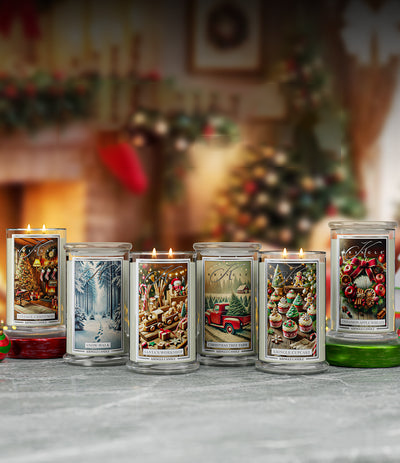 Row of holiday-themed candles on a surface with a festive background