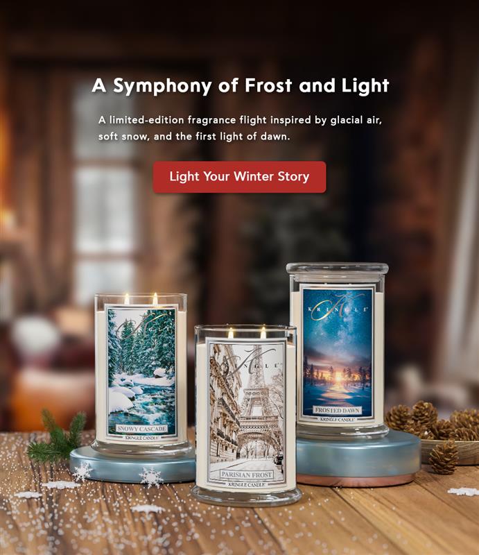 Three candles with winter-themed labels on a wooden surface, with a blurred indoor background.