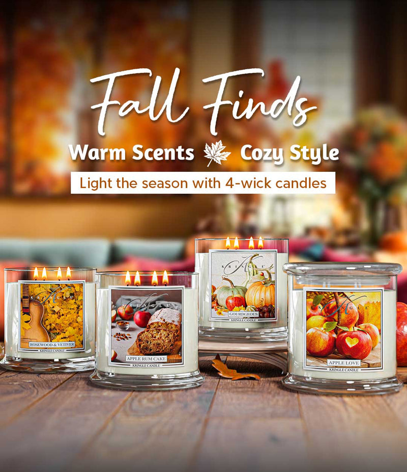 Four-wick candles with fall-themed labels on a wooden surface, with 'Fall Finds' text above.