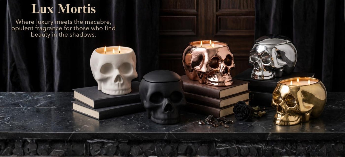 Lux Mortis skull-shaped candle holders in white, black, rose gold, silver, and gold, styled on dark books against a dark background with gothic text overlay.