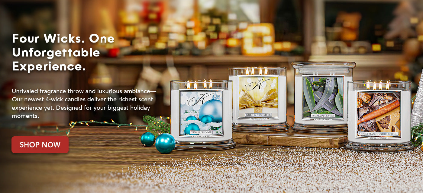 Four-wick candles with holiday decorative packaging on a wooden surface, promotional text overlay.