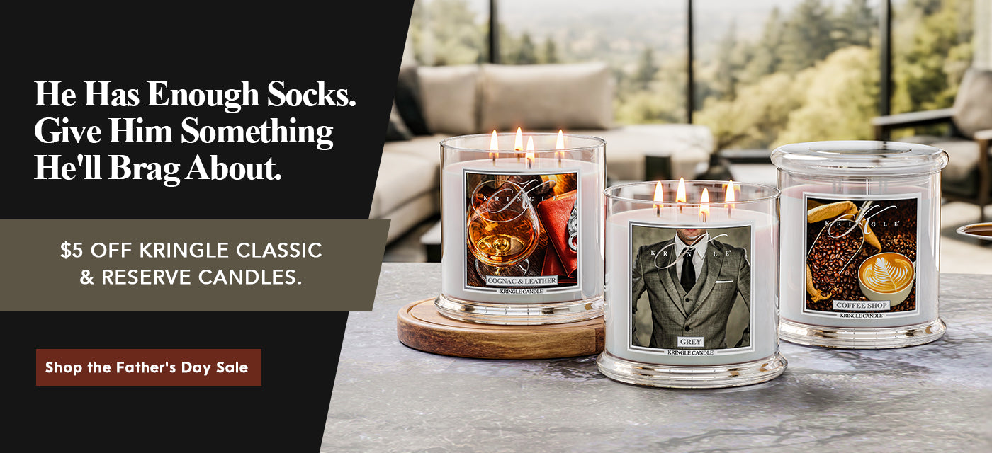 Three Kringle Candle scented candles on a table with promotional text for Father's Day sale.
