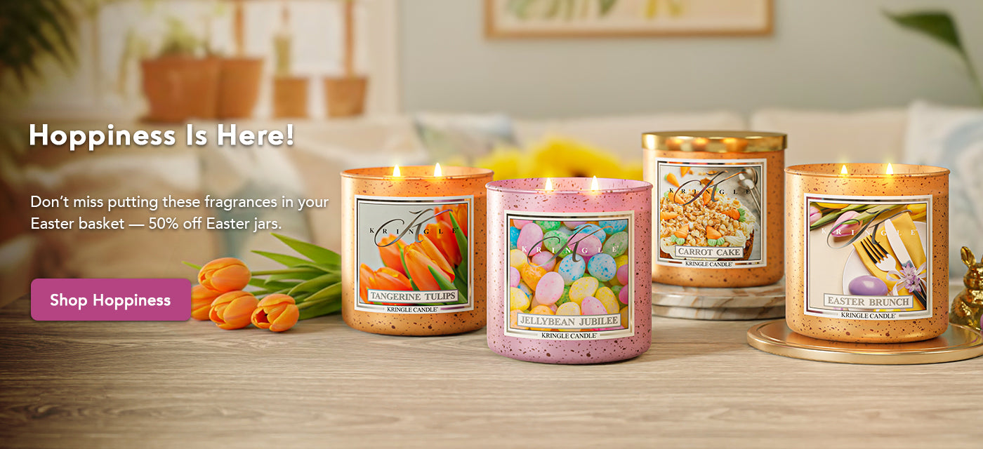 Four candles with Easter-themed designs on a wooden surface, with promotional text overlay.