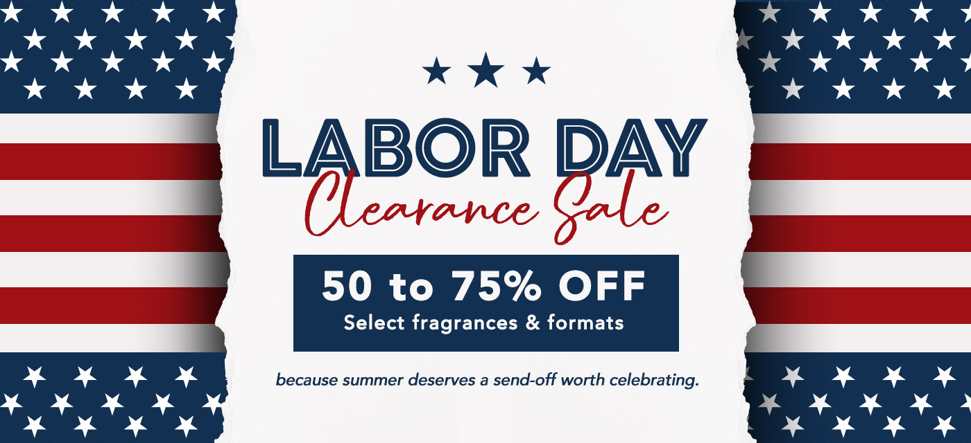 Labor Day Clearance Sale promotional banner with a white central panel, torn-edge American flag borders on the left and right, and text reading '50 to 75% OFF' and 'Select fragrances & formats'.