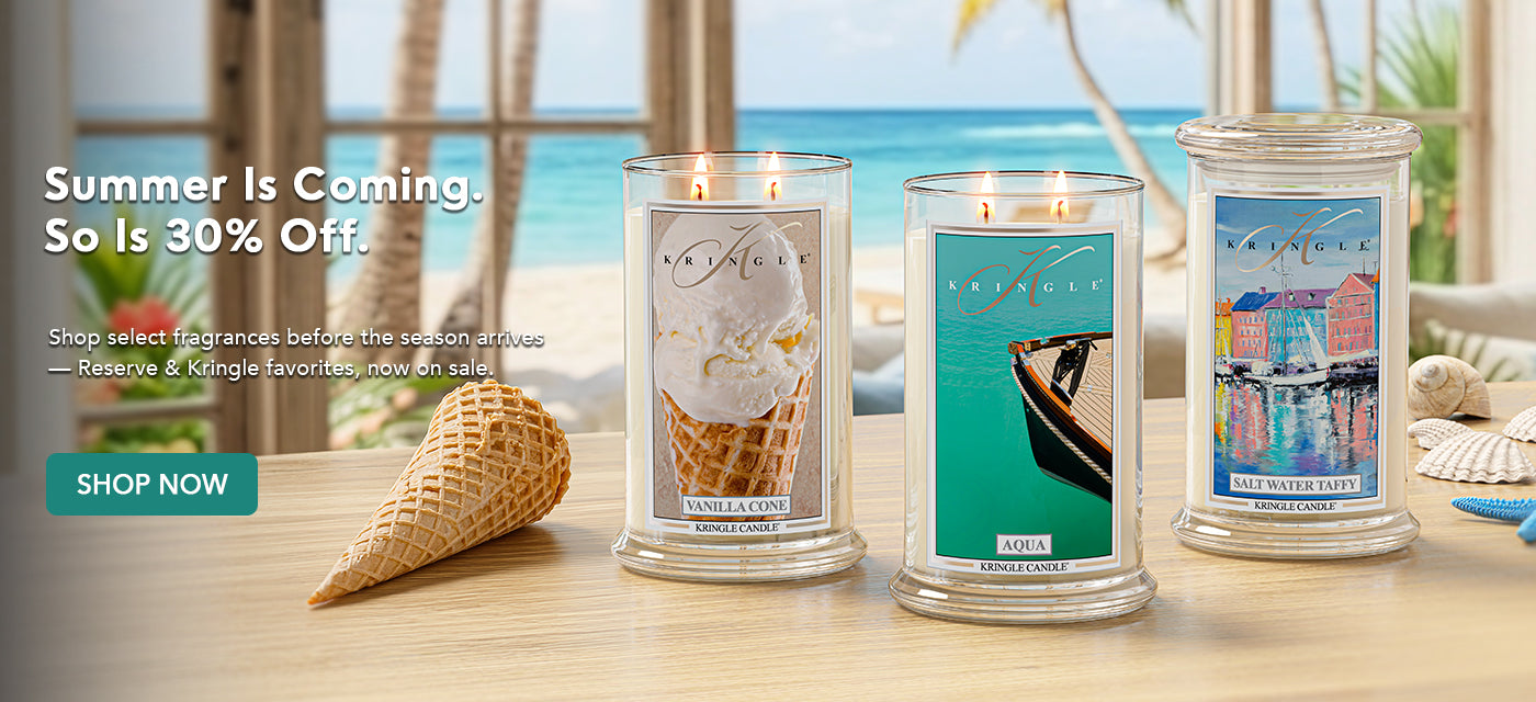 Summer Is Coming. So Is 30% Off. Three Kringle Candles — Vanilla Cone, Aqua, and Salt Water Taffy — displayed on a wooden surface with a tropical beach backdrop. Shop select Reserve and Kringle favorite fragrances now on sale.