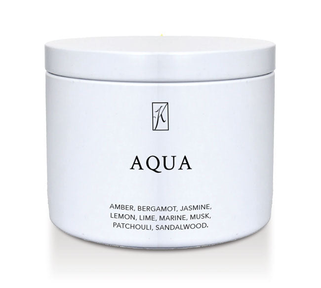 White candle tin container labeled 'Aqua' with a brand logo on a white background