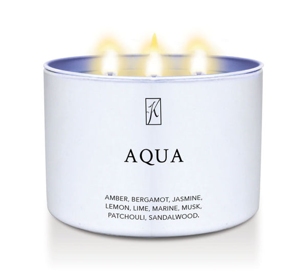 Candle in a white tin container labeled 'Aqua' with flames on a white background