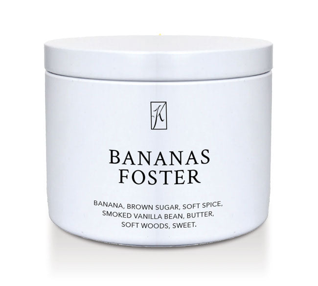 Jar of 'Bananas Foster' candle with branding on a white background