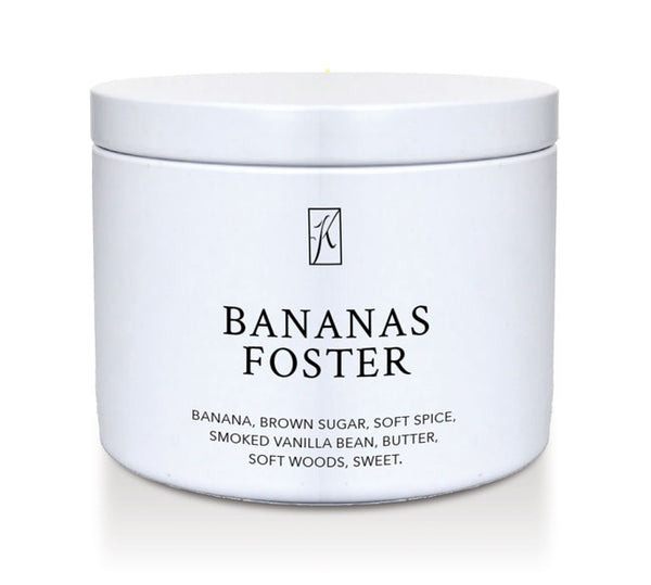 Jar of 'Bananas Foster' candle with branding on a white background