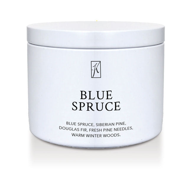 White candle jar labeled 'Blue Spruce' on a white background
