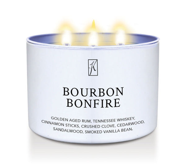 Candle in a white container labeled 'Bourbon Bonfire' with flames on a white background