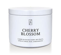 White tin container with 'Cherry Blossom' fragrance description on a white background