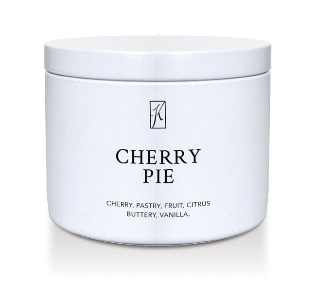 White tin container with 'K' logo and 'Cherry Pie' candle description on a white background by Kringle Candle.