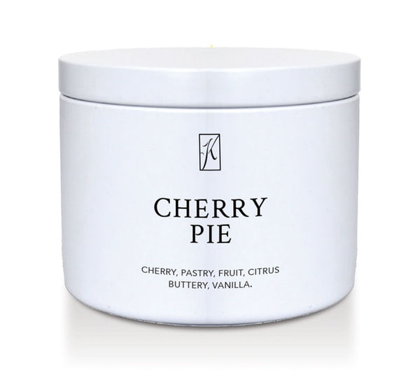 White tin container with 'K' logo and 'Cherry Pie' candle description on a white background by Kringle Candle.